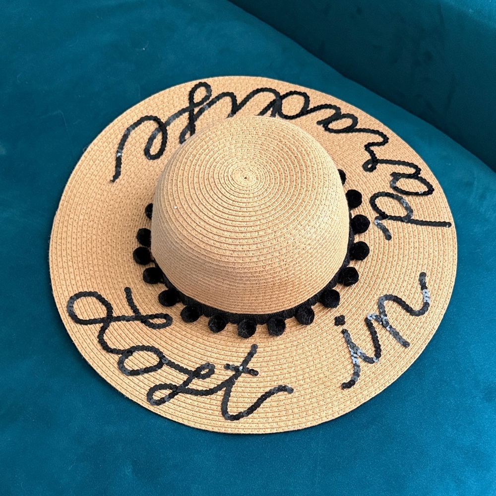Tan Wide Brim Hat with Black Pom Poms: Lost In Paradise